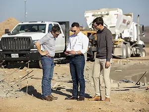 NXSTEP Team Photo at site with truck.